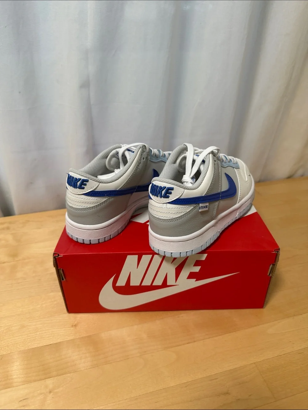 Nike Kids Low Top Sneakers in White and Blue Accent